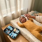 Parent grooming baby with kit - lifestyle