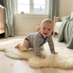Baby wearing knee pads while crawling - lifestyle