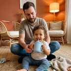 Baby drinking from the Bubzies straw cup on a cosy living room floor