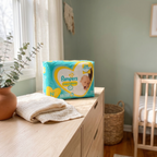 Pampers Swaddlers Newborn Size 1 diapers in a cozy nursery — Bubzies